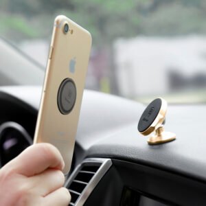 Magnetic car phone holder mounted on dashboard holding smartphone