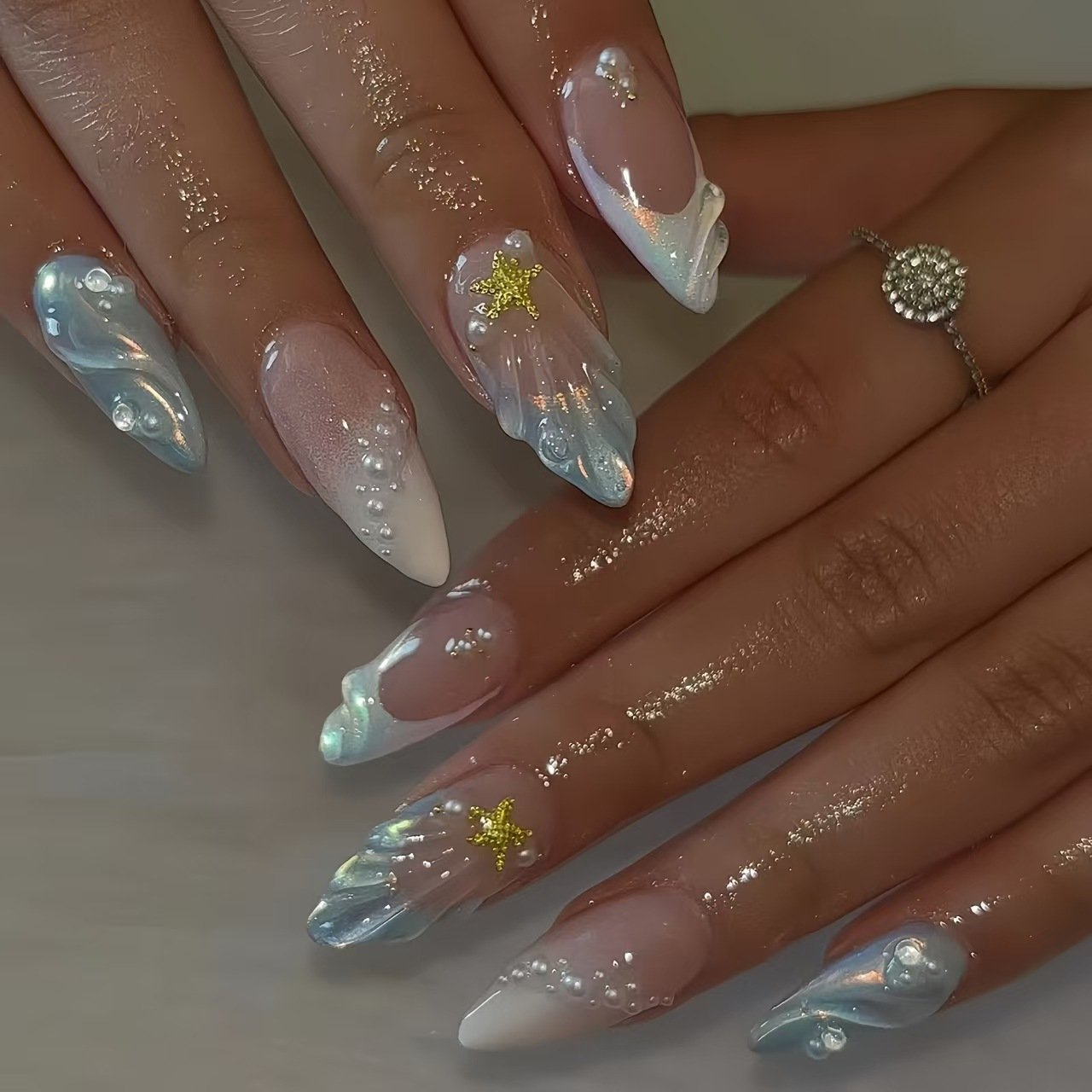 Ocean pearl almond press-on nails with gold stars
