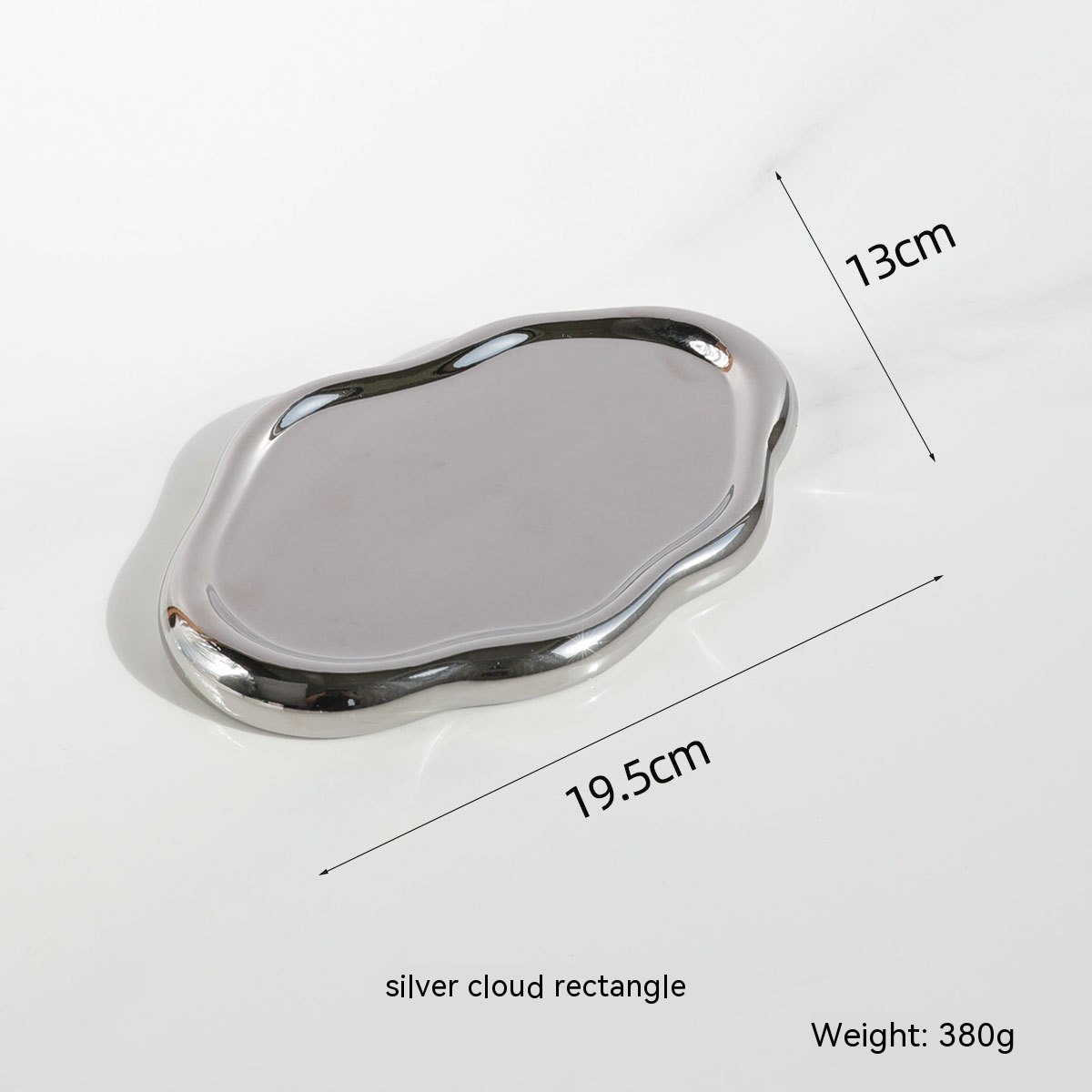 Ceramic tray holding jewelry and perfume